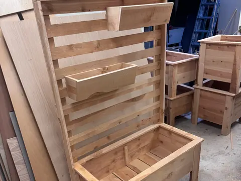 Cedar trellis planter being finished in the workshop